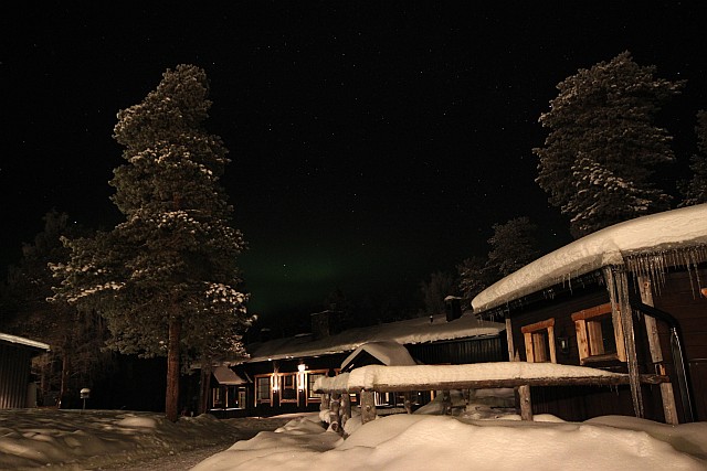 The second night we see Aurora over the roofs of the hotel buildings. To best see the Northern Lights at this destination, the hotel owner has negotiated that street lights in the entire village turn off at 23:00 hours.