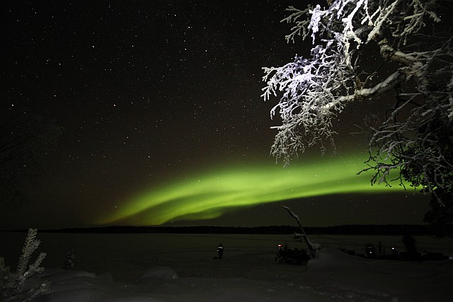 The last evening our guide takes us to 'Aurora Camp' on a small island in Lake Inari, by snowmobile. Light pollution is zero at this remote spot, 15 kilometers from the hotel. Aurora is at its best this evening!