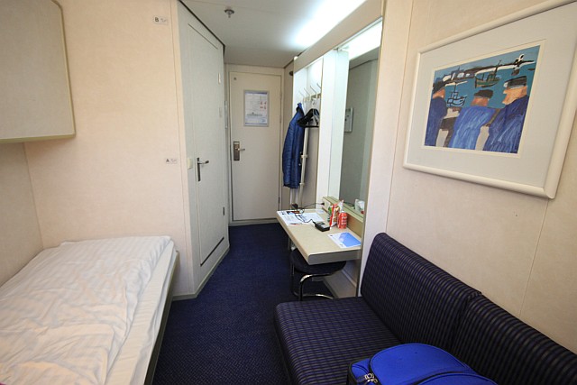 This is one of several cabin options on board, in this case a 2-person outside cabin with bunk beds and a small sofa. All cabins have private facilities and a small desk. 