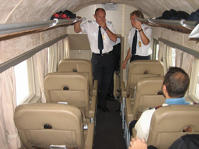 Once inside, the crew explains some of the features of the trimotor aircraft. The third pilot also acts as flight attendant before take off, explaining the safety features of this Junckers Ju-52/3M. Then he pushes himself into the cramped cockpit to help his colleagues starting the engines. I guess there will be no coffee and sandwich on this flight...